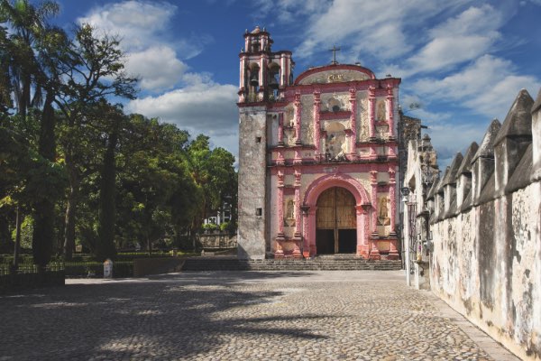 an old pink building in Mexico