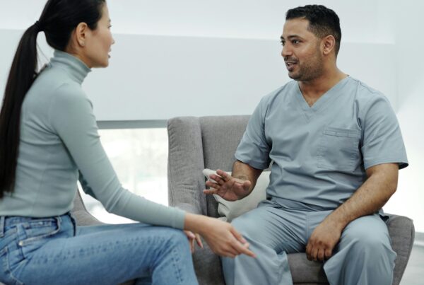 An intern conducting a check-up with a patient.