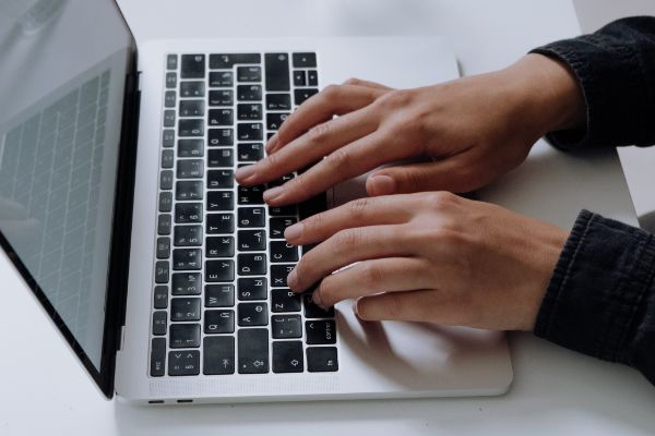 virtual intern typing in her laptop