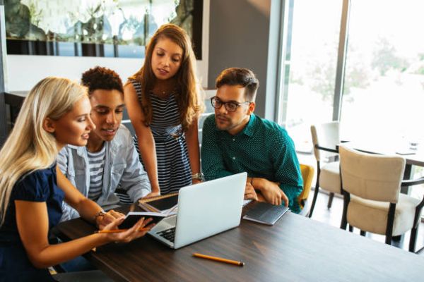 in-text image 6 A group of young people working in front of the laptop