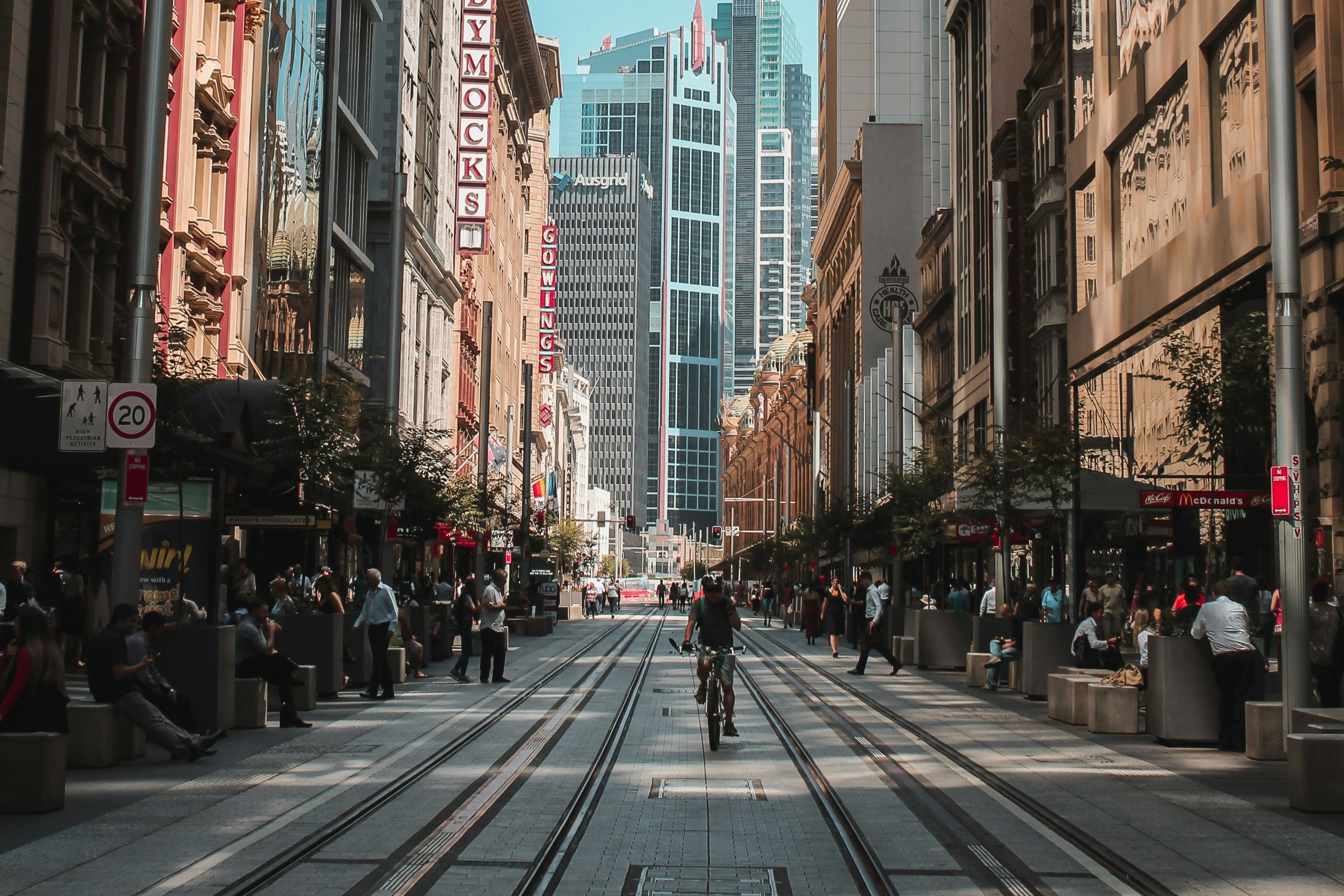 City street with shops and a cyclist