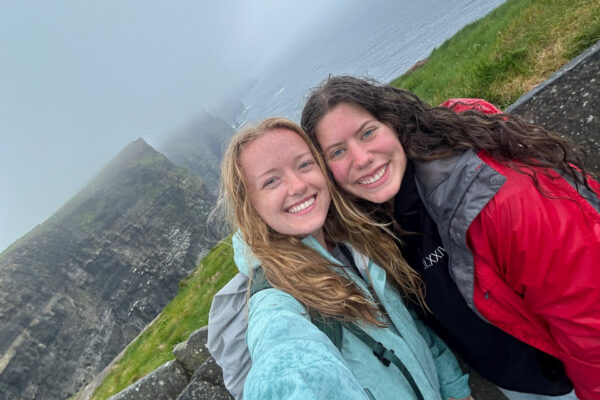 Adventures with Friends: "Interns posing at the very rainy and windy Cliffs of Moher"
