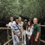 A group of six people standing on steps in Tanzania.