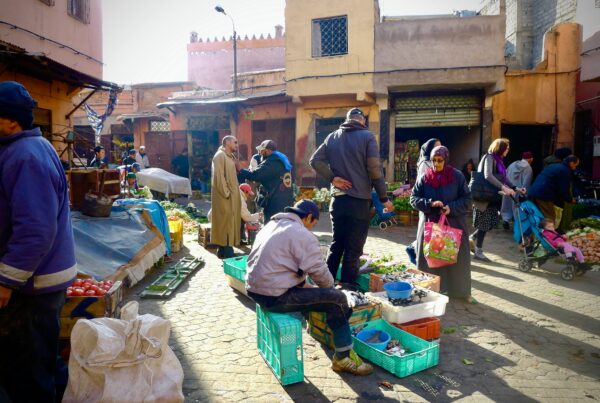An intersection crowded with people in Morocco.